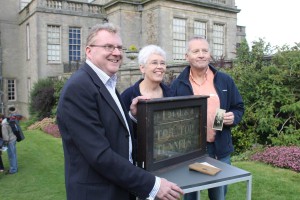 New Mills delegation with the Tor Top trench sign at BBC's Antiques Road Show in Lyme Park (copyright New Mills Heritage & Information Centre)